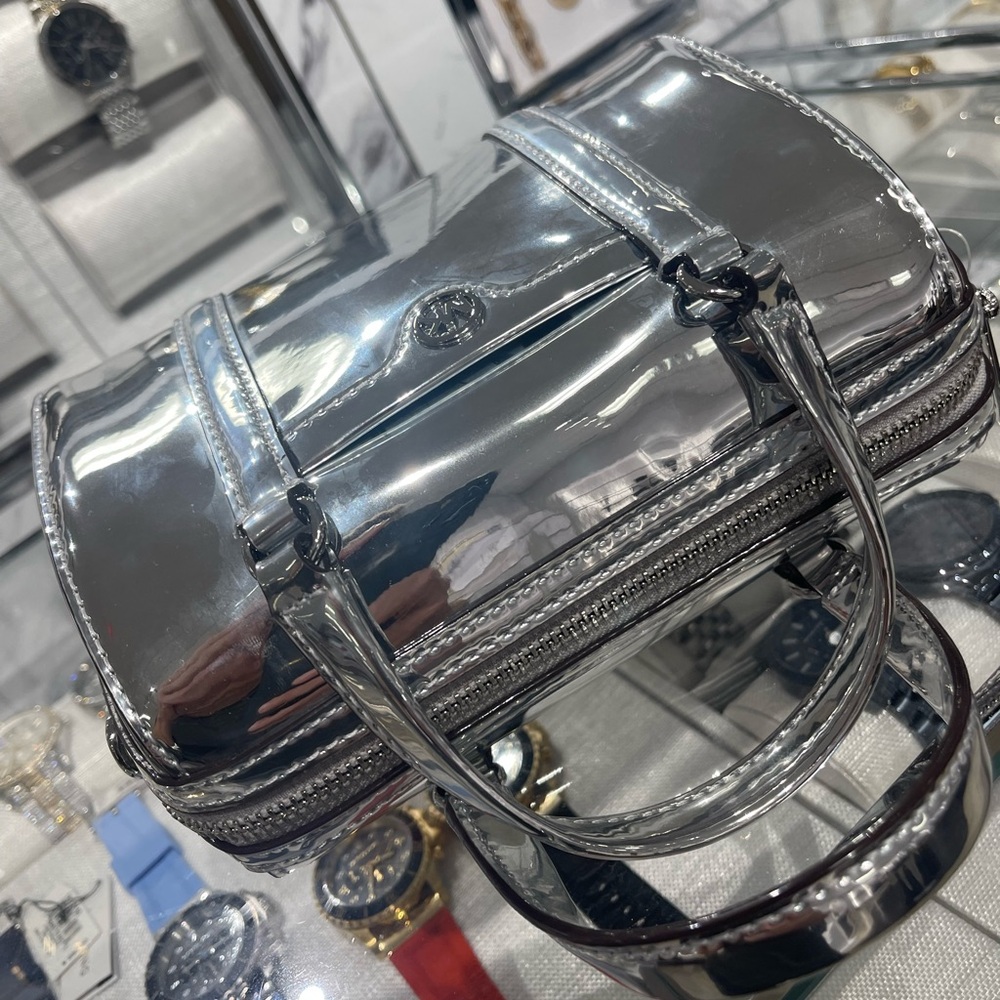 MICHAEL KORS Jet Set Small Patent Duffel Xbody Crossbody Bag
Silver 
NWT - Picture 12 of 16